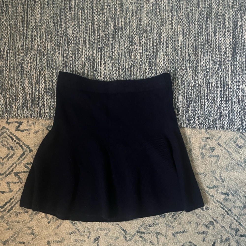 Cute navy knit mini skirt with slight flare. Never worn
